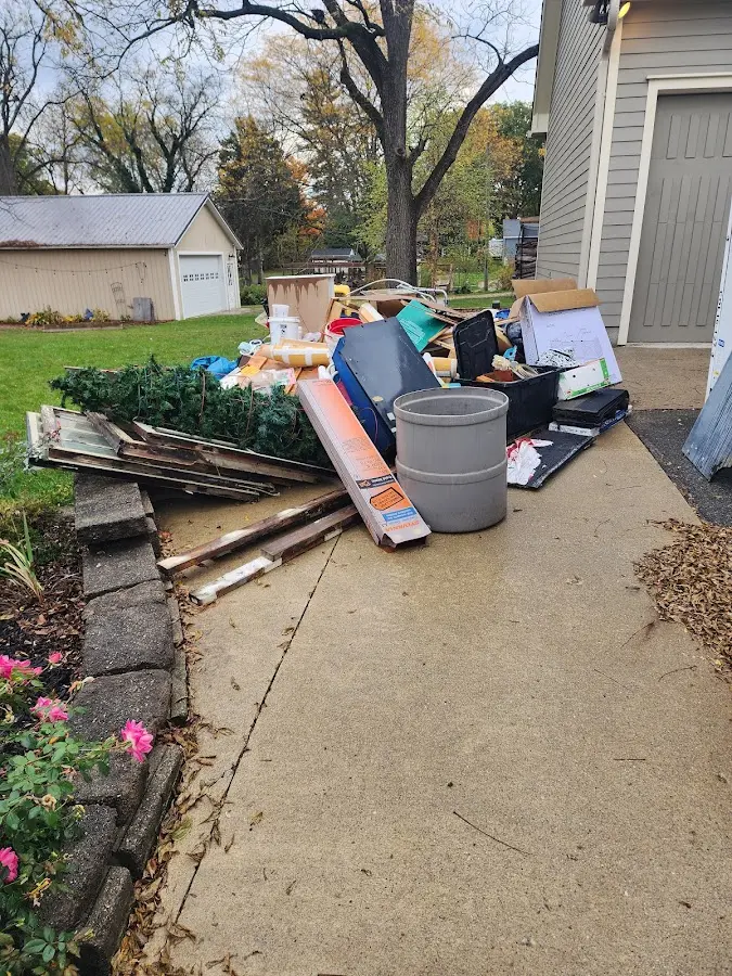 Dumpster being loaded with debris for 3 Yard Dumpster Rental in Grants Pass